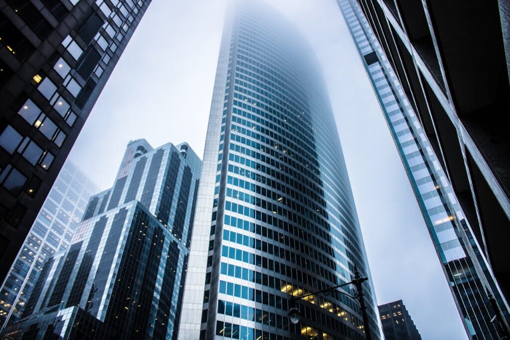 pexels-photo-936722 Dramatic view of modern skyscrapers shrouded in fog in an urban cityscape.